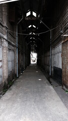Obraz premium June 16 2021, Minburi, Thailand : Dark narrow alley an old town of Minburi old market, undeveloped area with old buildings.