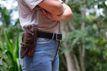 Knife in the case attached and hang on the belt of the woman