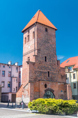 Fototapeta na wymiar Bytow, Poland - May 31, 2021: Gothic Tower in city center of Bytow, Poland.