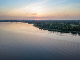 Fototapeta premium Sunrise over the wide river Dnieper. Aerial drone view.