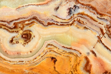 Onyx. Texture of semi-precious stone in pink and beige color 