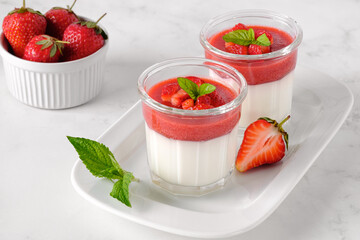 Traditional italian dessert panna cotta with strawberries. Gluten-free vegetarian food. Horizontal orientation.