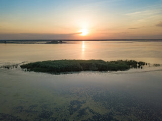 Fototapeta premium Sunrise over the wide river Dnieper. Aerial drone view.