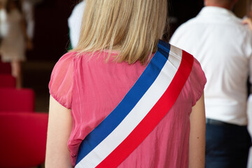 French blonde woman mayor with scarf france flag tricolor and pink dress during official...