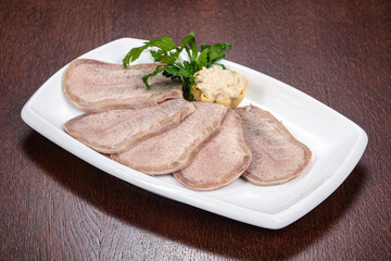 Sliced beef tongue on the plate