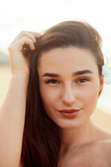 Fototapeta premium Happy woman on beach. beautiful girl. Young pretty girl. smiling woman portrait.