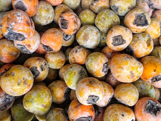 selective focus on persimmons(Diospyros kaki) in the market