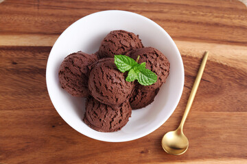 chocolate ice cream in white bowl on cutting board