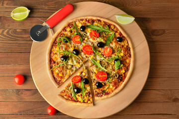 Board with tasty pizza on wooden background