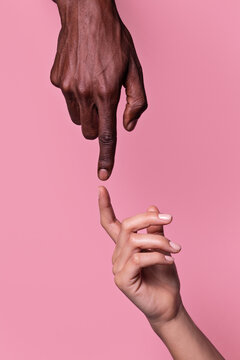 Opposed Hands Of African-american Man Pointing At Each Other Wit Index Finger Isolated On Pink Background