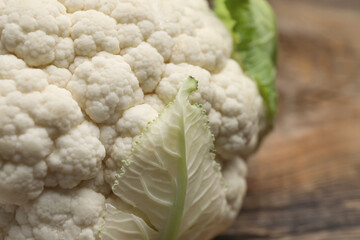 Cauliflower cabbage on wooden background, closeup