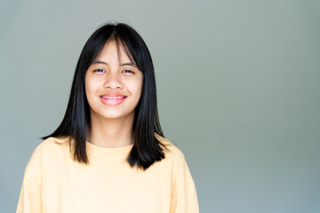 Fototapeta premium Dental Brace Girl Smiling and Looking to Camera, She Feel Happy and Have Good Attitude with Dentist. Motivate Kids not Fear When they have to go to Dental Clinic.