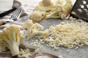 Board with grated cauliflower cabbage, closeup