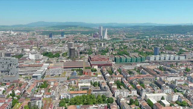 Basel: Aerial view of city in Switzerland at border with France and Germany, knee of river Rhine in center of city, clear blue sky - landscape panorama of Europe from above