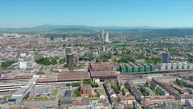 Basel: Aerial view of city in Switzerland at border with France and Germany, knee of river Rhine in center of city, clear blue sky - landscape panorama of Europe from above