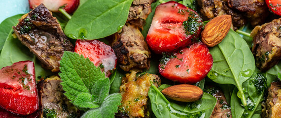 Strawberry Salad with baby spinach, chicken liver, almond and mint. Healthy fats, clean eating for weight loss