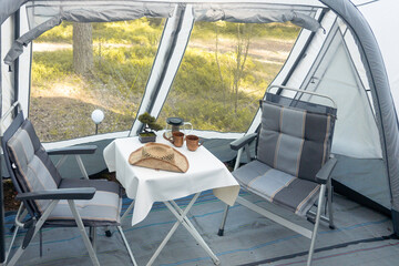Annex to the caravan. Comfortable interior for a trip, folding table and chairs.