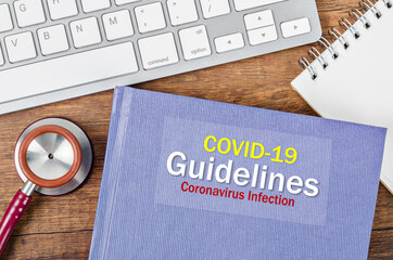 COVID-19 GUIDELINES, Coronavirus infection book with stethoscope medical.
