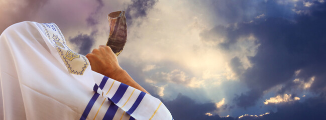 Jewish man blowing the Shofar (horn) of Rosh Hashanah (New Year). Religious symbol
