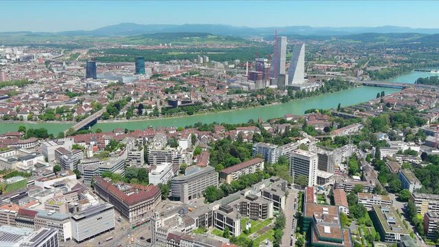 Basel: Aerial view of city in Switzerland at border with France and Germany, knee of river Rhine in center of city, clear blue sky - landscape panorama of Europe from above