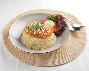 chef wok fried rice with crispy chicken chop cutlet and side salad asian halal menu