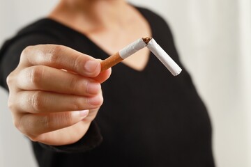 Women break cigarettes and quit this addiction permanently. world tobacco day perspective