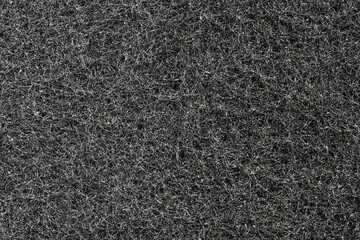 Dark grey filamentous texture and background. Sponge filamentous structure, macro close up background.