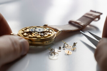 Watchmaker repair mechanical watches. Gears repair. Watch repair process