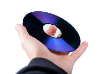 Hand holding up a CD or DVD disc, CD-ROM, DVD-ROM compact digital optical data storage, isolated on...