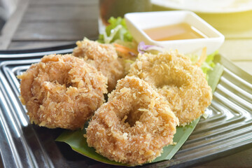 fried shrimp with flour pancake on plate in restaurant.