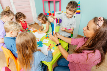 Preschool children learn english alphabet using cards