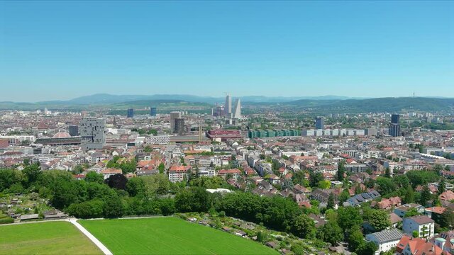 Basel: Aerial view of city in Switzerland at border with France and Germany, city outskirts with modern residential buildings, clear blue sky - landscape panorama of Europe from above