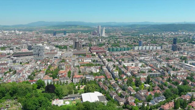 Basel: Aerial view of city in Switzerland at border with France and Germany, city outskirts with modern residential buildings, clear blue sky - landscape panorama of Europe from above