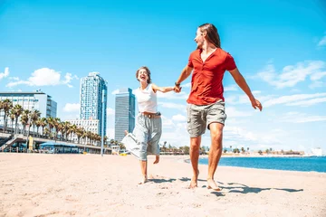 Foto op Canvas Happy couple in love enjoying vacation running on tropical beach - Boyfriend and girlfriend having fun outdoor on summer holiday - Vacations and lifestyle concept © Davide Angelini