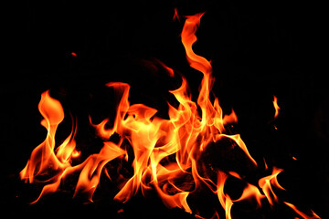 Fototapeta na wymiar flames on a black background.