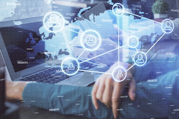 Double exposure of man and woman working together and social network theme hologram drawing. People connection concept. Computer background.