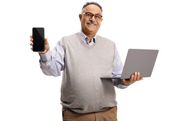 Mature man holding a laptop computer and showing a mobile phone