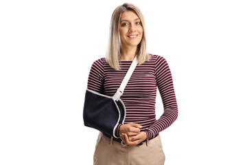 Young woman with a broken arm wearing an arm splint smiling at camera - obrazy, fototapety, plakaty