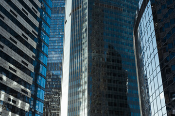 Business district of the city. Modern office building exterior. Close up of skyscrapers outside. Finance and business concept
