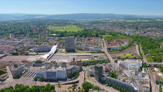 Basel: Aerial view of city in Switzerland at border with France and Germany, city outskirts with modern residential buildings, clear blue sky - landscape panorama of Europe from above