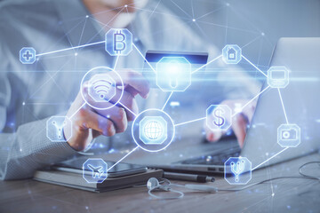 Double exposure of man hands holding a credit card and social network theme drawing. Digital...