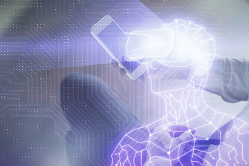 Double exposure of man's hands holding and using a digital device and AR glasses drawing. Virtual reality concept.