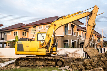 Backhoe excavator at house construction site