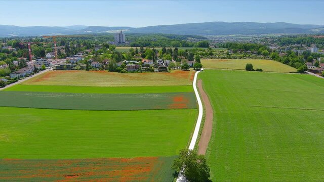 Basel: Aerial view of city in Switzerland at border with France and Germany, city outskirts with modern residential buildings, clear blue sky - landscape panorama of Europe from above