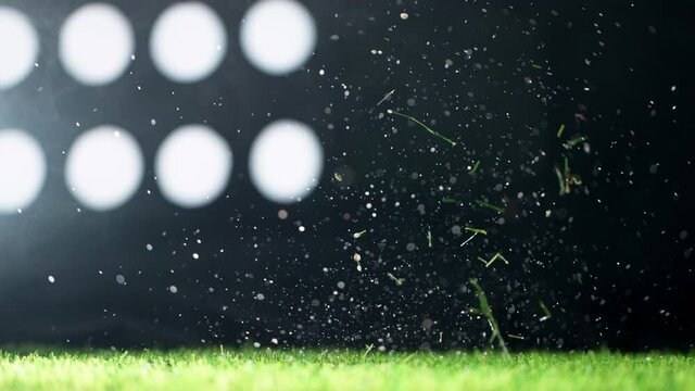 Super slow motion of falling soccer ball on lawn. Speed ramp effect. Filmed on high speed cinema camera, 1000fps.