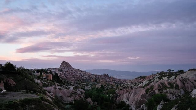Timelapse - Wide shot on rose valley in Cappadocia, Goreme, Turkey - full of unusual limestone rock formations. Fast motion landscape video of popular travel destination