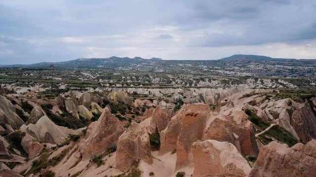 Timelapse - Wide shot on rose valley in Cappadocia, Goreme, Turkey - full of unusual limestone rock formations. Fast motion landscape video of popular travel destination