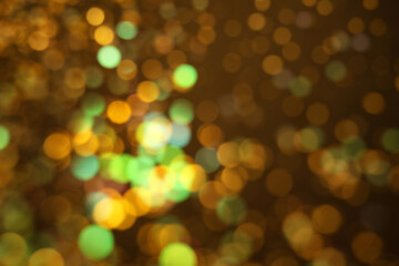 Fototapeta premium Blurred view of shiny lights on dark background. Bokeh effect
