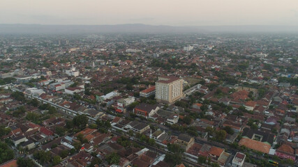 cityscape Yogyakarta with buildings, highway at sunset time. aerial view cultural capital Indonesia yogyakarta located on java island, Indonesia