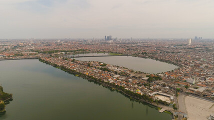 Fototapeta premium Aerial cityscape city Surabaya with skyscrapers, buildings and houses. urban environment in asia city skyline with skyscrapers and business centers java, indonesia